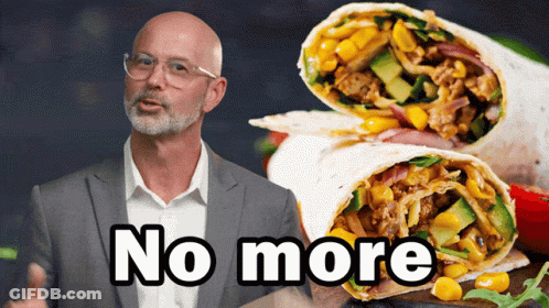 A Man In A Suit Is Standing Next To A Burrito That Says No More GIF