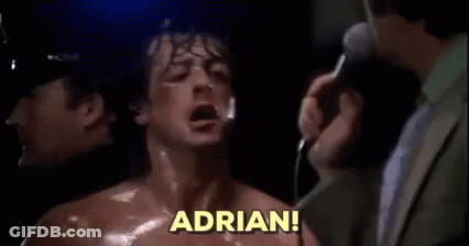 A Man In A Suit Is Standing Next To A Man In A Boxing Ring With His Mouth Open . GIF