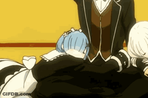 A Man In A Suit Is Standing Next To A Woman With Blue Hair GIF