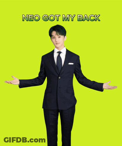 A Man In A Suit Is Standing With His Arms Outstretched In Front Of A Yellow Background That Says Neo Got My Back GIF
