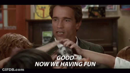 A Man In A Suit Is Surrounded By Children And Says `` Good Now We 'Re Having Fun '' . GIF