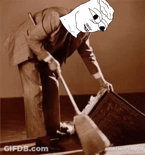 A Man In A Suit Is Sweeping The Floor With A Cartoon Face On His Face GIF