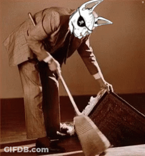 A Man In A Suit Is Sweeping The Floor With A Rabbit Mask On His Head GIF