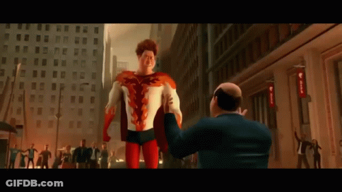 A Man In A Suit Is Taking A Picture Of A Superhero On The Street . GIF