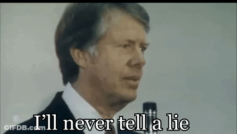 A Man In A Suit Is Talking Into A Microphone And Saying `` I 'Ll Never Tell A Lie '' . GIF
