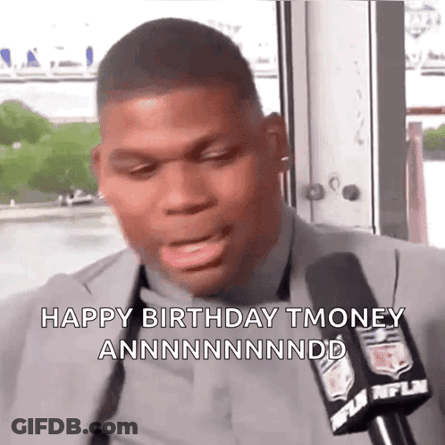 A Man In A Suit Is Talking Into A Microphone And Says Happy Birthday Tmoney GIF