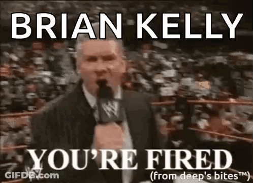 A Man In A Suit Is Talking Into A Microphone In Front Of A Crowd And Says `` You 'Re Fired '' . GIF