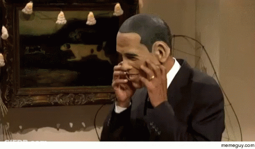 A Man In A Suit Is Talking On A Cell Phone In Front Of A Framed Painting GIF
