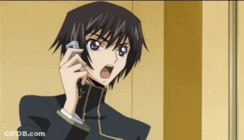 A Man In A Suit Is Talking On A Cell Phone . GIF
