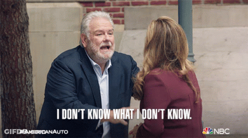 A Man In A Suit Is Talking To A Woman Who Says I Don T Know What I Don T Know GIF