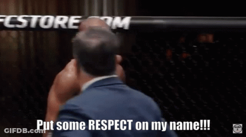 A Man In A Suit Is Talking To Another Man In A Boxing Ring And Says " Put Some Respect On My Name " GIF