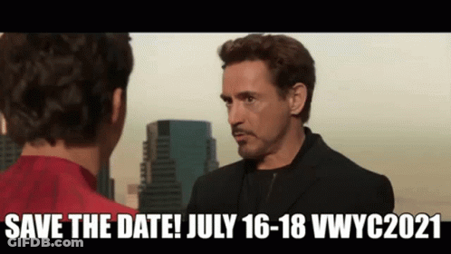 A Man In A Suit Is Talking To Another Man In A Red Shirt In Front Of A City . GIF