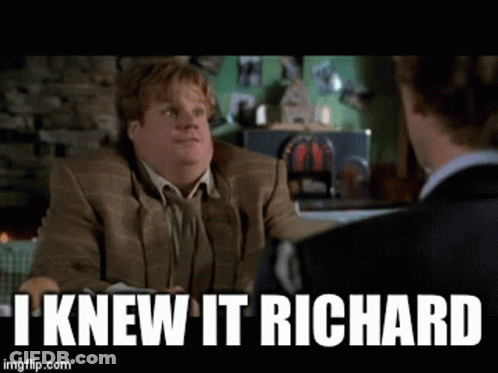 A Man In A Suit Is Talking To Another Man With The Caption I Knew It Richard .. GIF