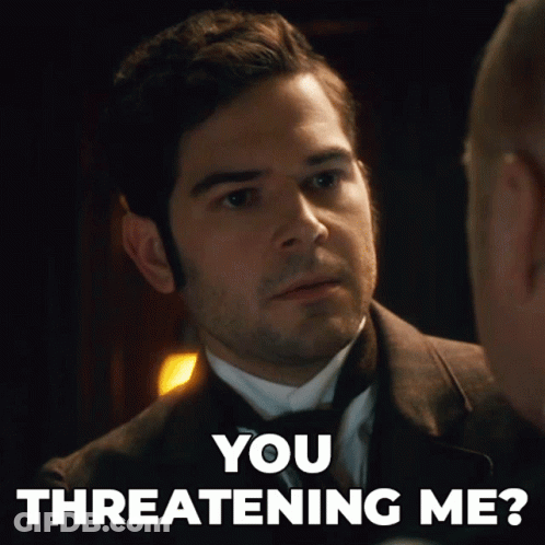 A Man In A Suit Is Talking To Another Man With The Words You Threatening Me GIF