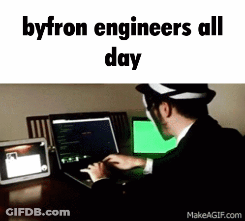 A Man In A Suit Is Typing On A Laptop With The Words Byron Engineers All Day Below Him GIF