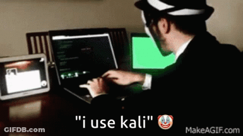 A Man In A Suit Is Typing On A Laptop With The Words " I Use Kali " Below Him GIF