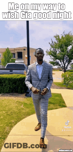 A Man In A Suit Is Walking Down A Sidewalk With A Caption That Says Me On My Way To Wish Gia Good Night GIF