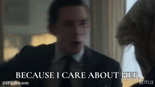 A Man In A Suit Says " Because I Care About Her " In Front Of A Woman GIF