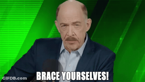A Man In A Suit Says Brace Yourselfs In Front Of A Green Background GIF