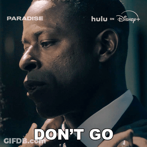 A Man In A Suit Says " Don 'T Go " GIF