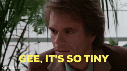 A Man In A Suit Says Gee It 'S So Tiny In Yellow GIF