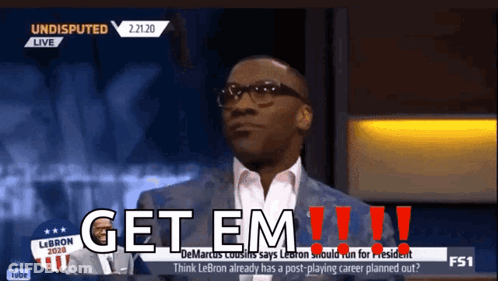 A Man In A Suit Says Get Em !!! GIF