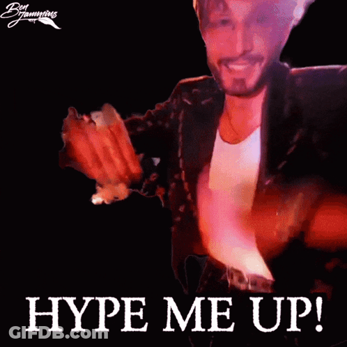 A Man In A Suit Says Hype Me Up In Front Of A Black Background GIF