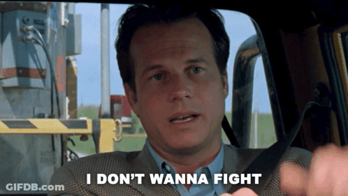 A Man In A Suit Says " I Don T Wanna Fight " GIF