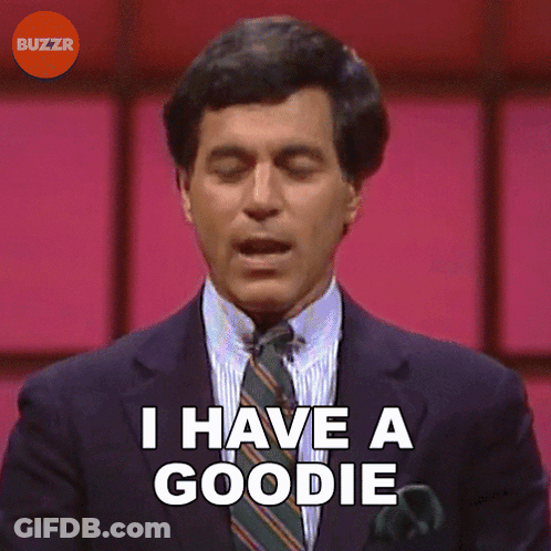 A Man In A Suit Says I Have A Goodie GIF