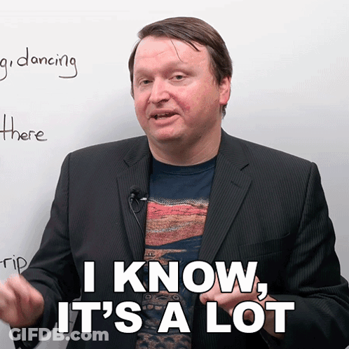 A Man In A Suit Says " I Know It 'S A Lot " In Front Of A White Board GIF