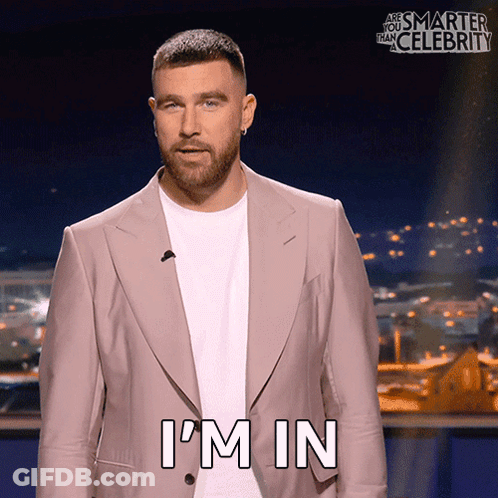A Man In A Suit Says I 'M In On A Screen GIF