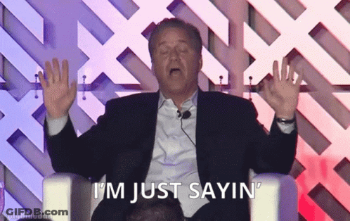A Man In A Suit Says I 'M Just Sayin ' While Sitting In A Chair GIF
