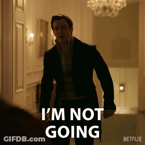 A Man In A Suit Says " I 'M Not Going " While Standing In A Hallway GIF