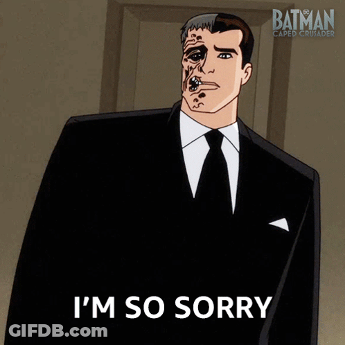 A Man In A Suit Says I 'M So Sorry In Front Of A Batman Logo GIF