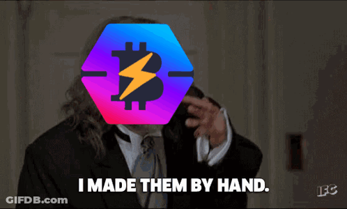 A Man In A Suit Says " I Made Them By Hand " In Front Of A Bitcoin Symbol GIF
