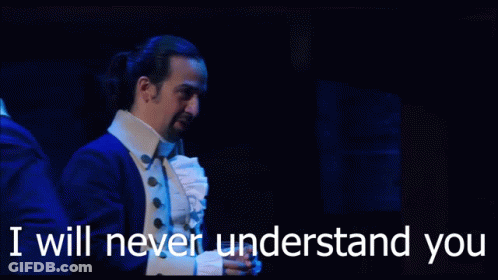 A Man In A Suit Says " I Will Never Understand You " While Standing On A Stage GIF