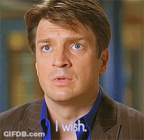 A Man In A Suit Says " I Wish " In Front Of His Face GIF