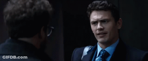 A Man In A Suit Says It 'S Showtime While Talking To Another Man GIF