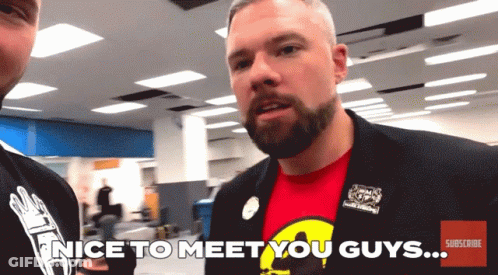 A Man In A Suit Says Nice To Meet You Guys On The Screen GIF