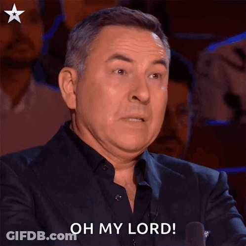 A Man In A Suit Says Oh My Lord With His Mouth Open GIF