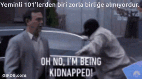 A Man In A Suit Says Oh No I 'M Being Kidnapped In Front Of A Man In A Mask GIF