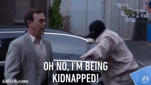 A Man In A Suit Says Oh No I 'M Being Kidnapped In Front Of A Man In A Mask GIF