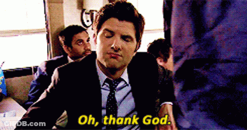 A Man In A Suit Says Oh Thank God GIF