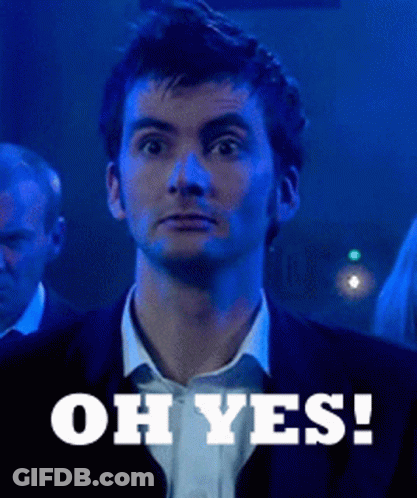 A Man In A Suit Says " Oh Yes " In Front Of Him GIF