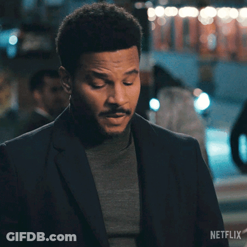 A Man In A Suit Says Okay In A Netflix Advertisement GIF
