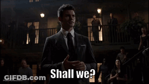 A Man In A Suit Says Shall We GIF