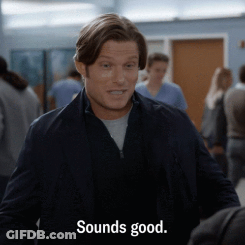 Man In Suit Saying Sounds Good In Crowd GIF