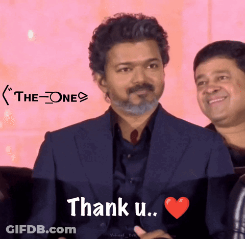 A Man In A Suit Says " Thank U " With A Red Heart GIF