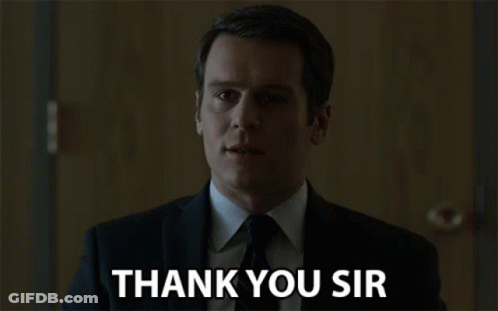 A Man In A Suit Says Thank You Sir In Front Of A Door GIF