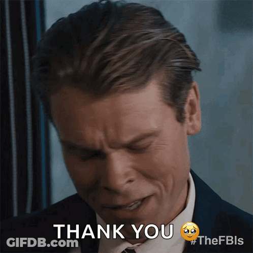 A Man In A Suit Says Thank You With A Sad Face GIF